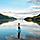 Woman Paddle Boarding Through the Mountains, Juneau, Alaska