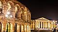 The Arena and Palazzo Barbieri at night in Verona. Italy.