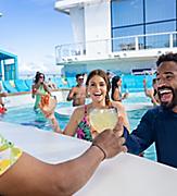 bartender handing couple cocktails swim and tonic pool star of the seas