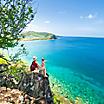 Family Sitting by the Coast. Basseterre, St. Kitts Nevis 