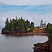 A red and white lighthouse on the coast of Prince Edward Island 