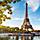 View of the Eiffel tower from the water with boats in Paris. Europe.