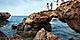 Family Jumping Through Rocks, Oranjestad, Aruba