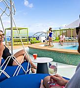 Relaxing Group of people chilling at Grove Suite sundeck pool on Icon of the Seas