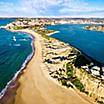 Nobby's beach and lighthouse in an aerial shot of Newcastle, Australia