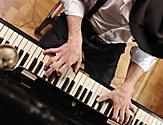 Close-Up of the Piano Player Performing 