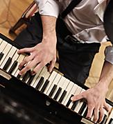 Close-Up of the Piano Player Performing 