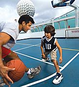 Father and Son Playing Basketball in the Sports Court 