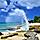 Wave Crashing Against Rocks on a Sunny Day in Frederiksted Beach, St. Croix, U.S. Virgin Islands