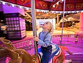 Young Boy Enjoying the Carousel 