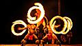 Three Hawaiian fire dancers at a traditional luau. Hawaii